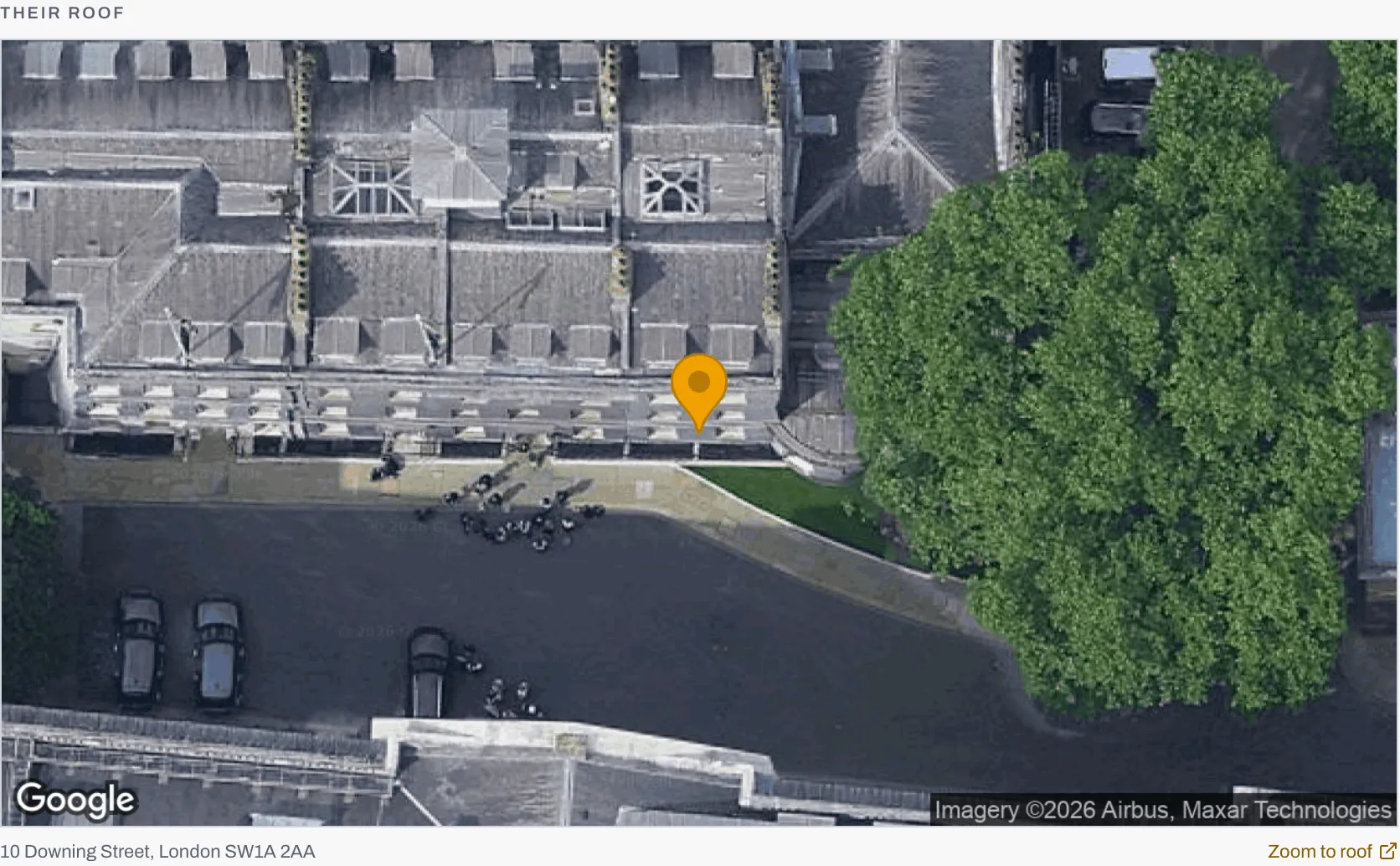 The Their roof panel: a satellite view of the property with the customer's marker dropped on it, the address underneath, and a Zoom to roof link.